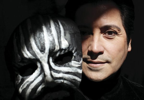 Val Valentino taking off his mask 