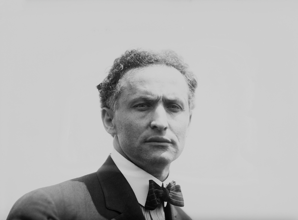 Harry Houdini looking down the lense in black and white film shot
