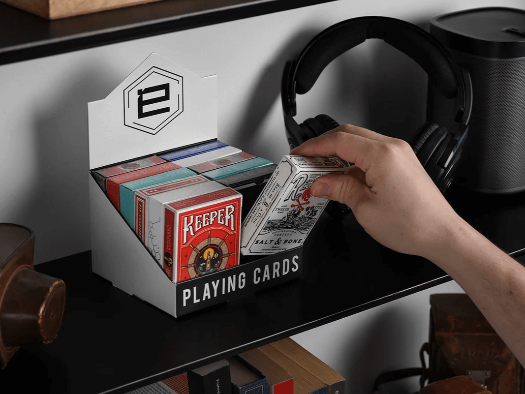 Ellusionist Playing Cards on a shelf in deck display