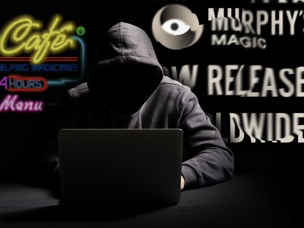 Hooded person at laptop with screenshots of murphy's emails and magic cafe forum in background