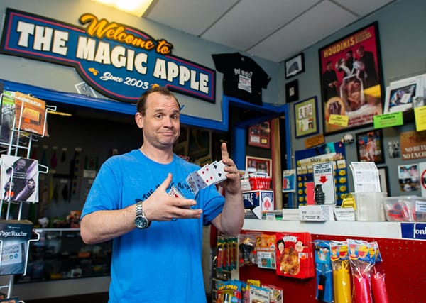 Magic Apple Shop Studio City owner springs cards inside the small store packed with tricks