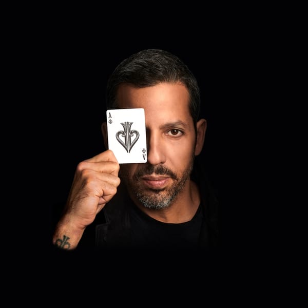 David Blaine holding ace of spades in front of eye