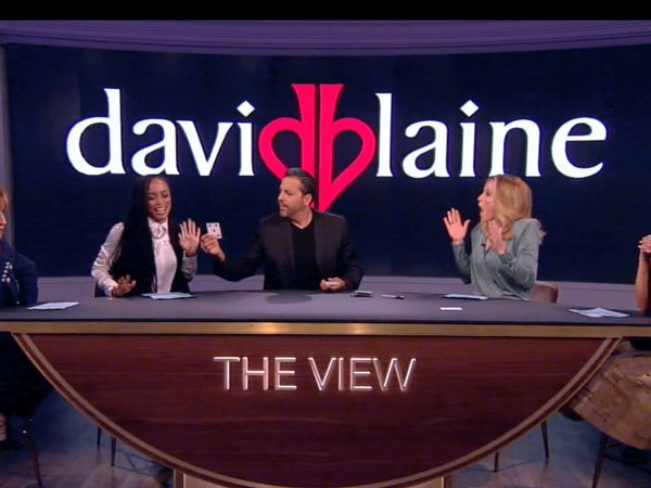Magician and stunt performer David Blaine smiles as hosts react to magic on "The View"