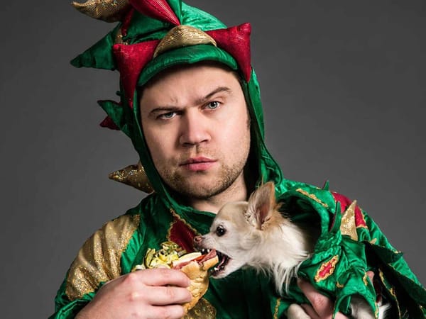 Piff The Magic Dragon with dog Mr Piffles eating his sandwich