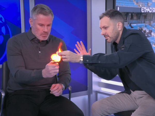 Magician Dynamo uses fire for a trick with sports personality Jamie Carragher