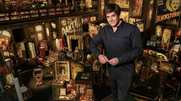 Iconic magician David Copperfield stands in front of his vast collection of props from magic's history